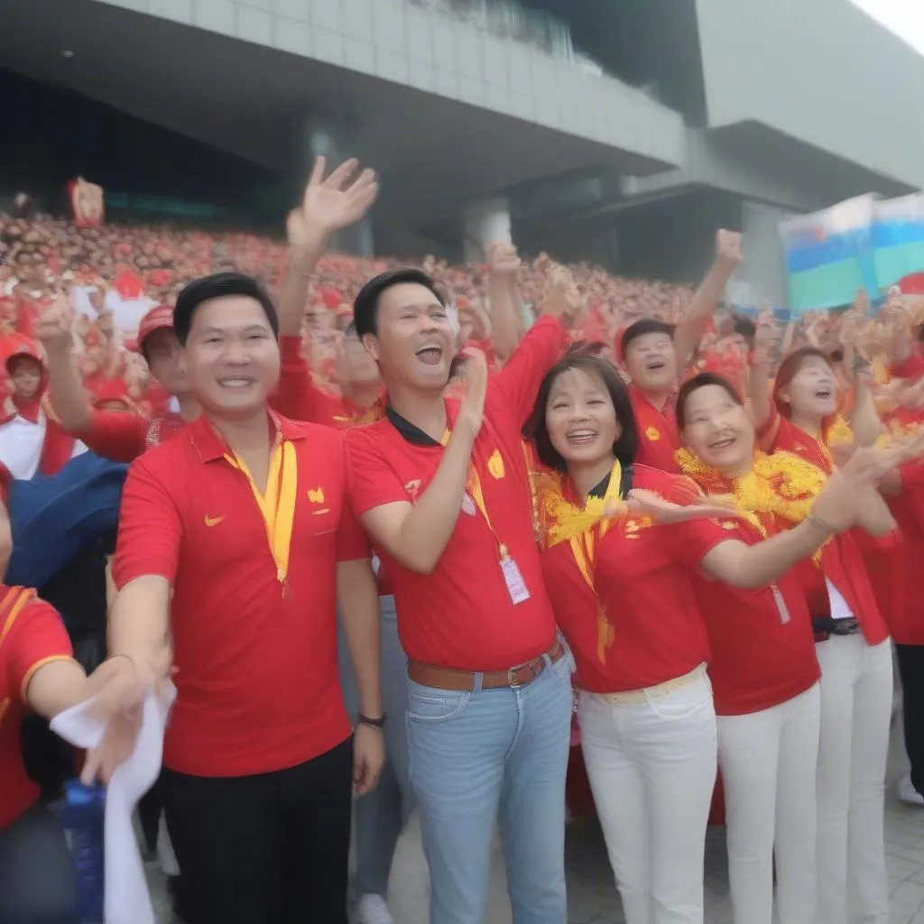 Vietnamese officials cheering for the Vietnamese team